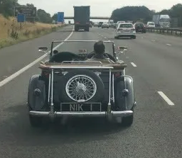 UK Number Plate NIK 1 on a 1955 Black MG Midget