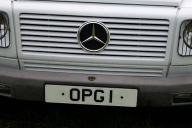 UK Number Plate OPG 1 on a 1992 White Mercedes 300