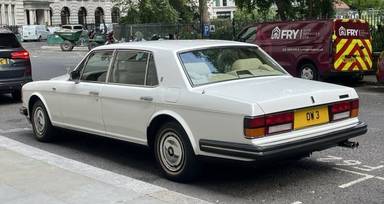 UK Number Plate OW 3 on a 1994 White Rolls Royce Silver Spur