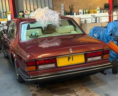 UK Number Plate P 1 on a 1982 RED Rolls Royce .