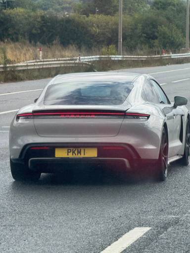 UK Number Plate PKM 1 on a 2024 Grey Porsche Taycan 4s
