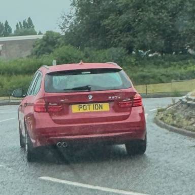 UK Number Plate POT 10N on a 2013 RED BMW 3 Series