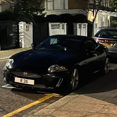 UK Number Plate R 35 on a 2010 Black Jaguar XKR
