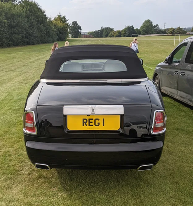 UK Number Plate REG 1 on a 2014 Black Rolls Royce Phantom