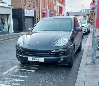 UK Number Plate REM 1 on a 2013 Black Porsche Cayenne V6 D Tiptronic