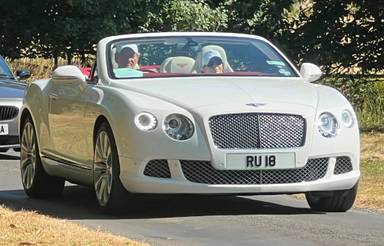 UK Number Plate RU 18 on a 2012 White Bentley Continental