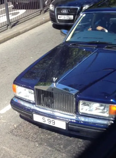 UK Number Plate S 99 on a 1996 Blue Rolls Royce Silver Spur