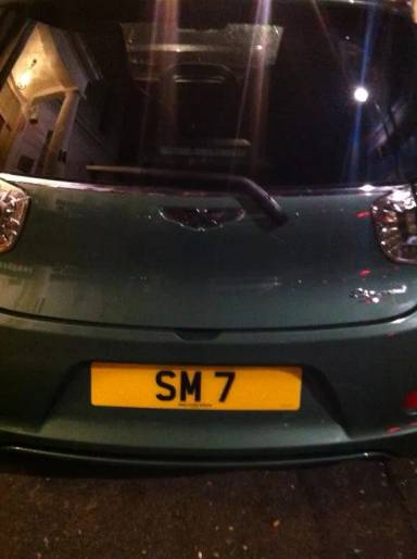 UK Number Plate SM 7 on a 2011 Green Aston Martin Cygnet