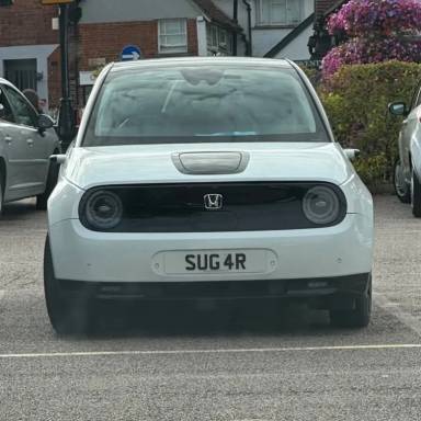 UK Number Plate SUG 4R on a 2020 White Honda E Advance