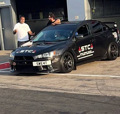 UK Number Plate SWE 4T on a 2010 Black Mitsubishi Lancer