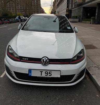 UK Number Plate T 95 on a 2014 White Volkswagen Golf