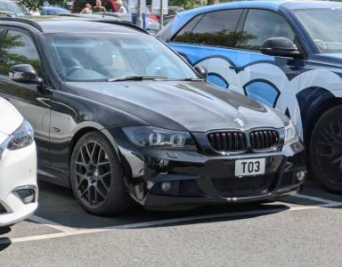 UK Number Plate TO 3 on a 2009 Black BMW 3 Series