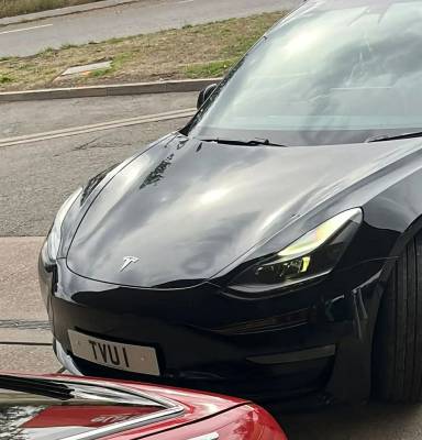 UK Number Plate TVU 1 on a 2021 Black Tesla Model 3 Long Range Awd