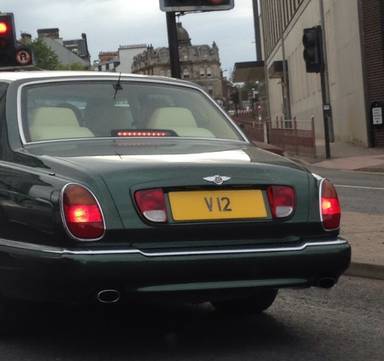 UK Number Plate V 12 on a 1999 Green Bentley Arnage