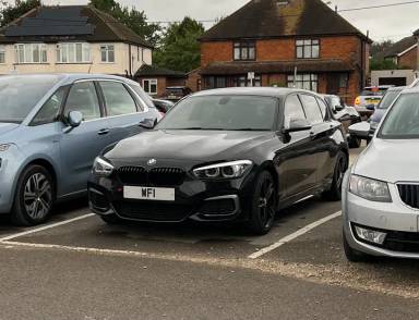 UK Number Plate WF 1 on a 2018 Black BMW 1 Series